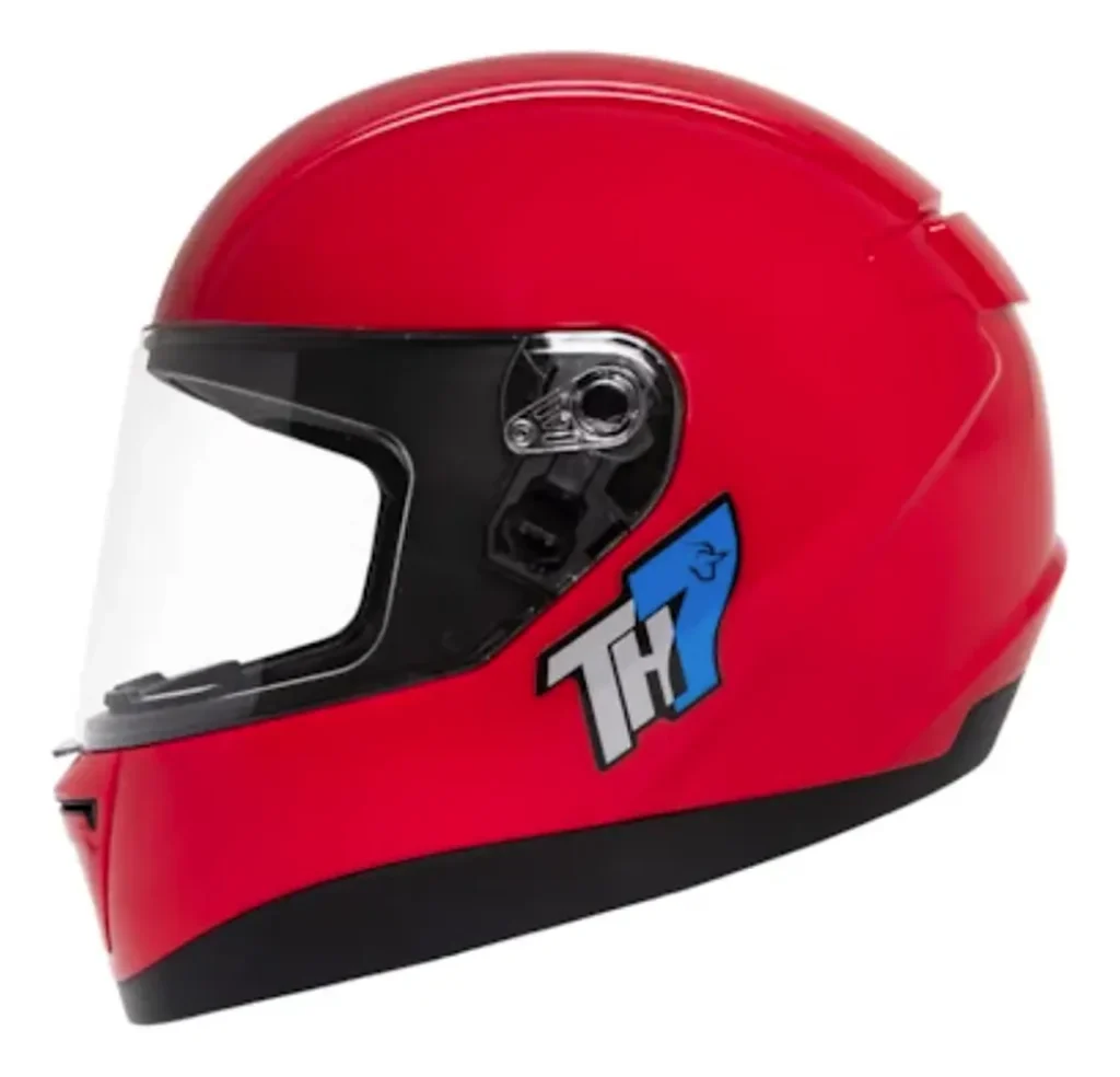 Capacete Taurus TH7 É Bom? Análise Completa Capacete Taurus TH7 integral vermelho, vista lateral com viseira cristal